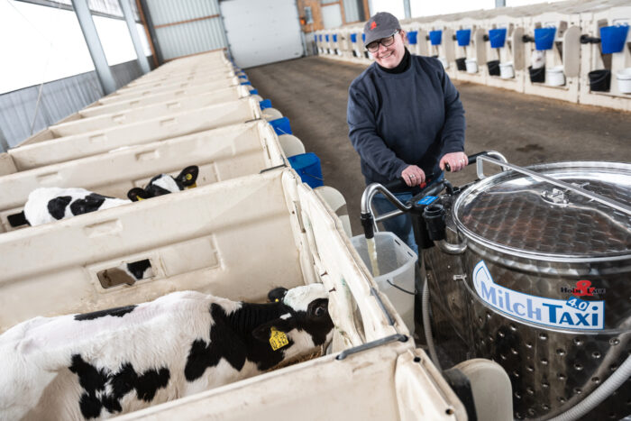 MilkTaxi dispensing milk in a PenSystem calf barn