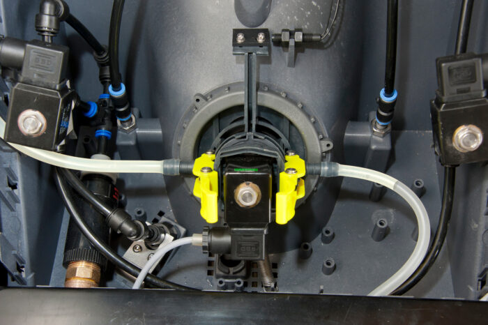 In this detail photo, you can see the hoses in the CalfExpert.
