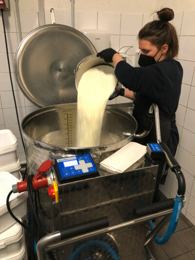 Anna mixing a mango-passion fruit sorbet ice cream mix in the MilkTaxi