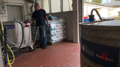 Donald WInkler standing next to a MilkTaxi